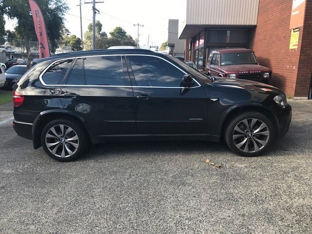 A prestige SUV is under maintenance in Blackburn Car Care service workshop